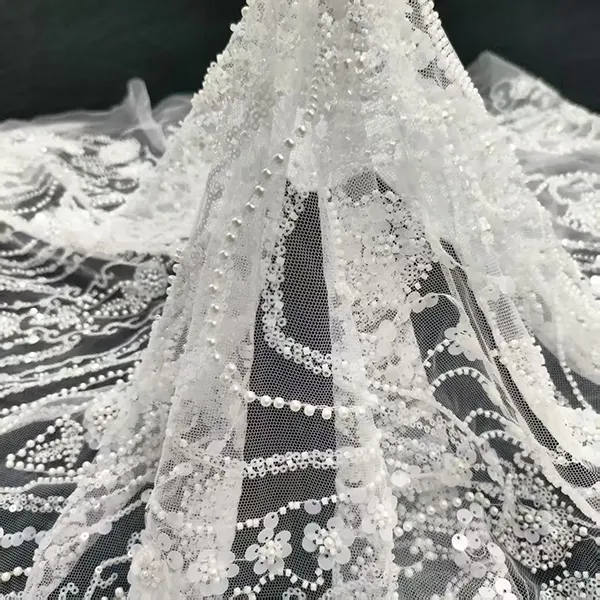 ຜ້າລູກປັດສີຂາວ Embroidery Lace Fabric Luxury White Bridal Dress Wedding Sequence Beaded Embroidery Lace Fabric